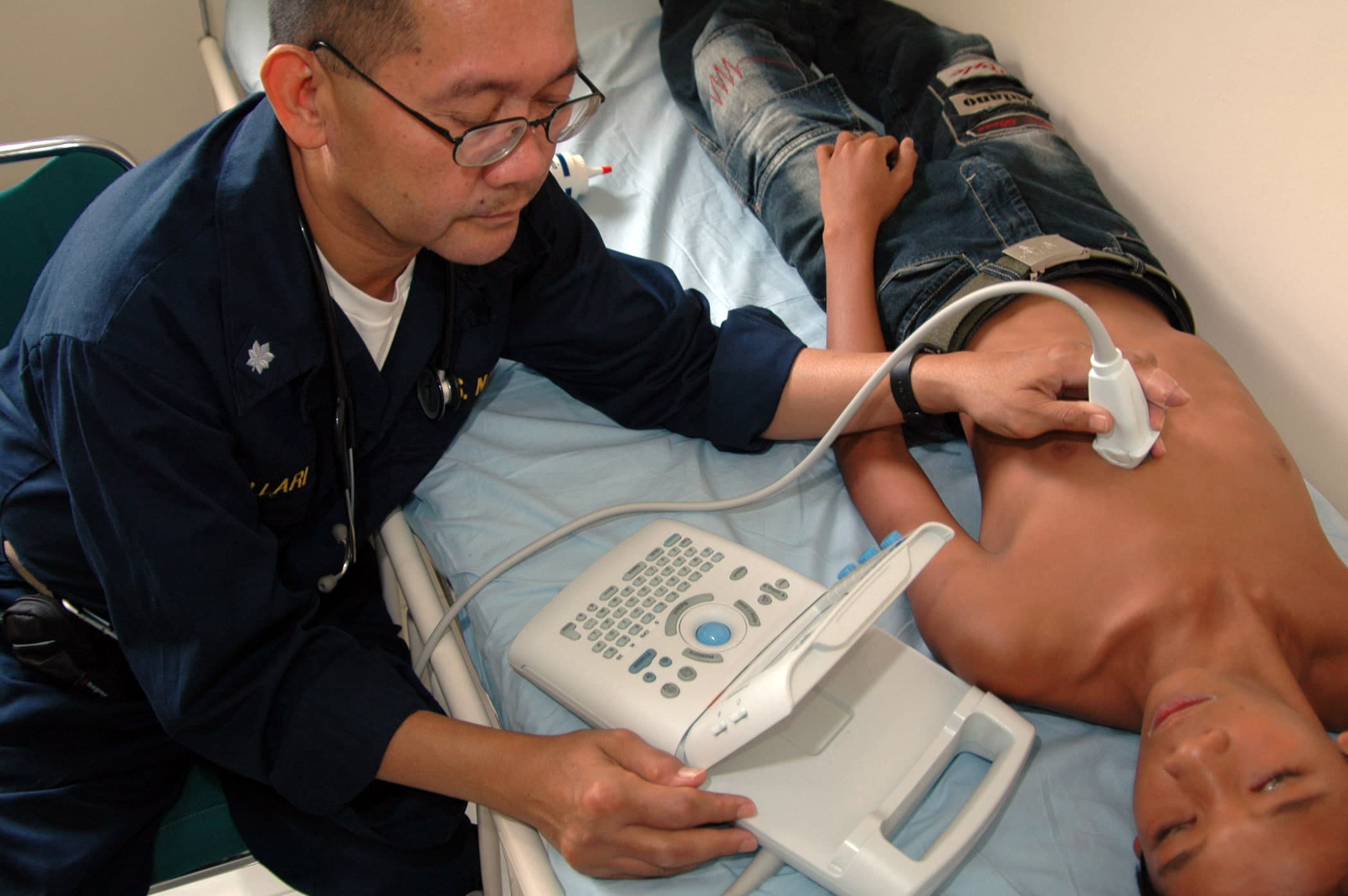 Physician performing a medical ultrasound examination